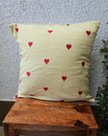 Yellow gingham check cotton cushion cover adorned with charming hand-embroidered red heart motifs.