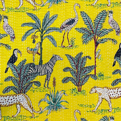 Jungle-themed fabric pattern with animals and plants on a yellow background
